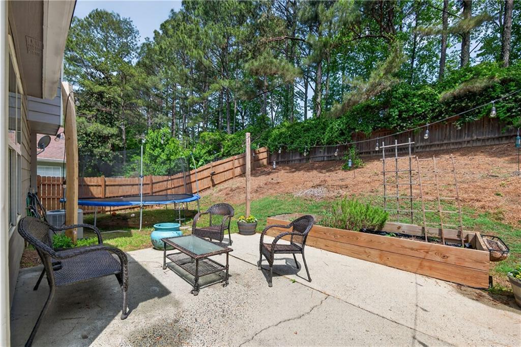 3904 Keystone Ridge Acworth, GA 30101 - Photo 11 of 45 a patio with water view fountain and a floor to ceiling window