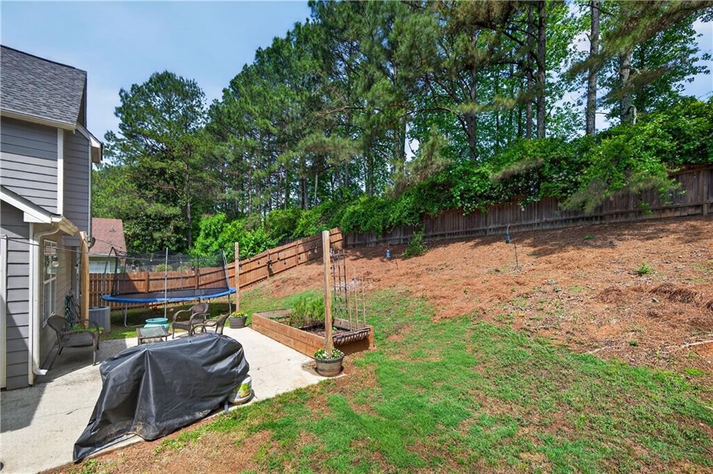 3904 Keystone Ridge Acworth, GA 30101 - Photo 12 of 45 a view of backyard with outdoor seating and plants