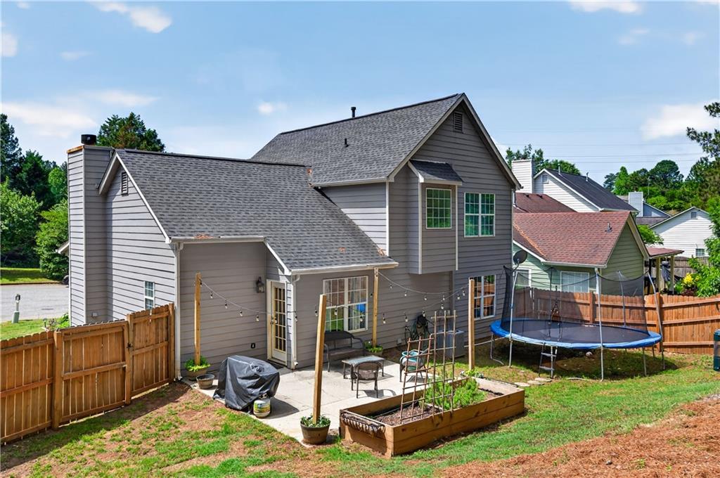 3904 Keystone Ridge Acworth, GA 30101 - Photo 14 of 45 a front view of house with yard outdoor seating and barbeque oven