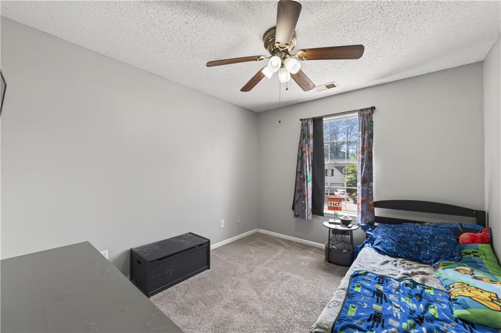 3904 Keystone Ridge Acworth, GA 30101 - Photo 17 of 45 a bed room with furniture and a window