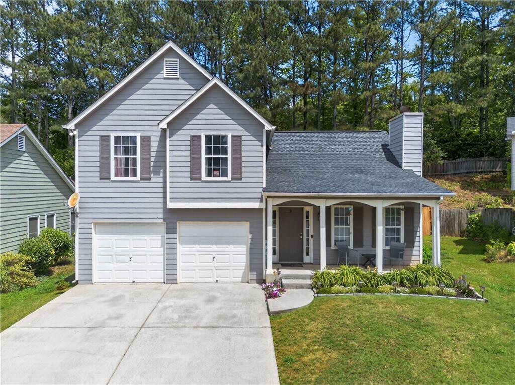 3904 Keystone Ridge Acworth, GA 30101 - Photo 2 of 45 a front view of a house with a yard