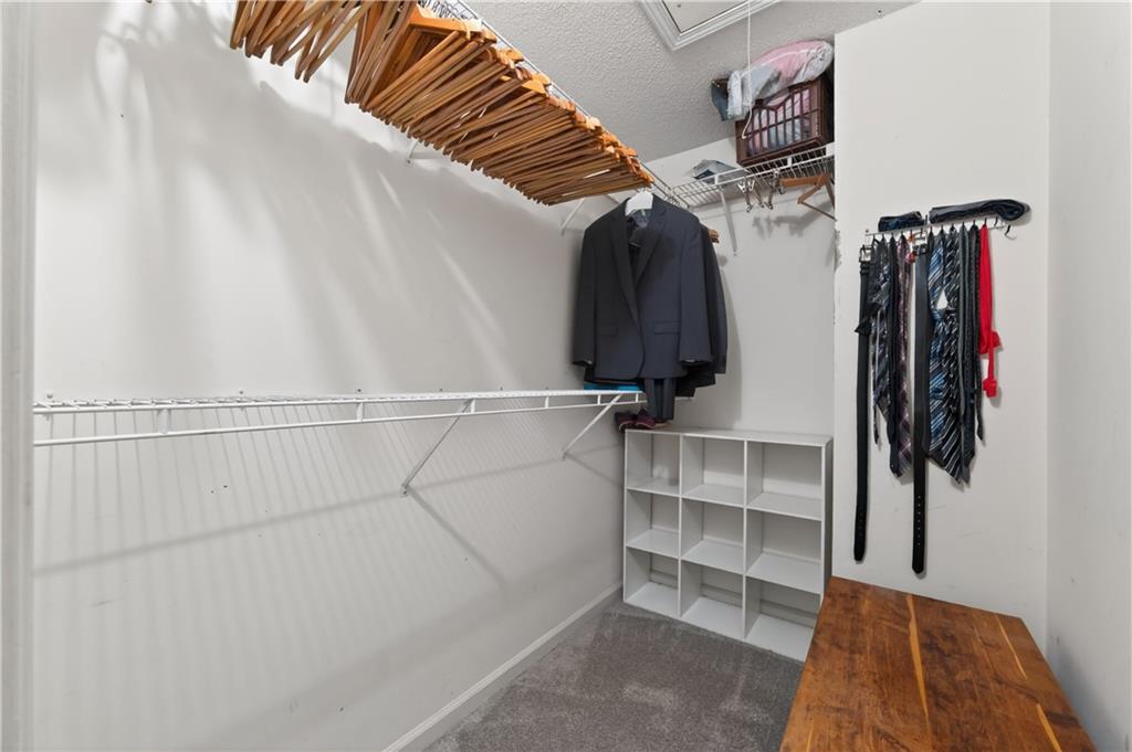 3904 Keystone Ridge Acworth, GA 30101 - Photo 24 of 45 a view of walk in closet with clothes and shoes
