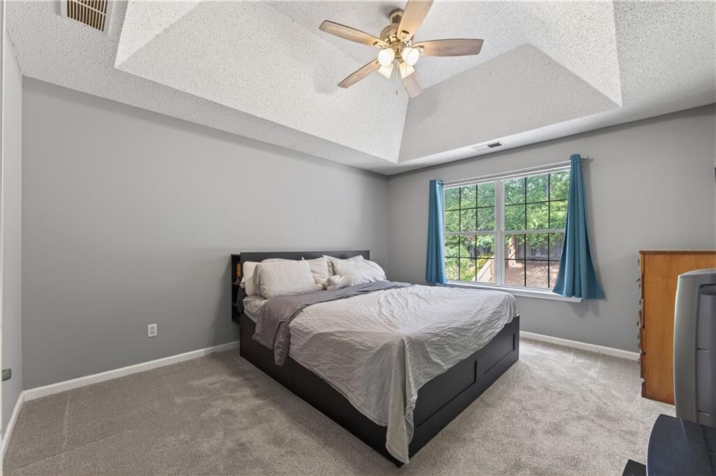 3904 Keystone Ridge Acworth, GA 30101 - Photo 25 of 45 a bed sitting in a bedroom next to a window