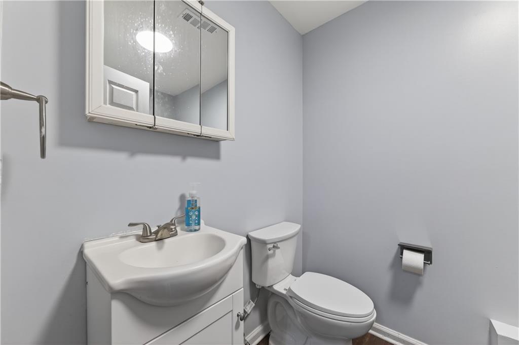 3904 Keystone Ridge Acworth, GA 30101 - Photo 28 of 45 a bathroom with a toilet a sink and mirror
