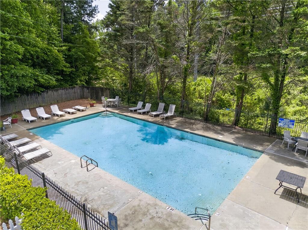 3904 Keystone Ridge Acworth, GA 30101 - Photo 7 of 45 a view of a swimming pool with a yard and sitting area