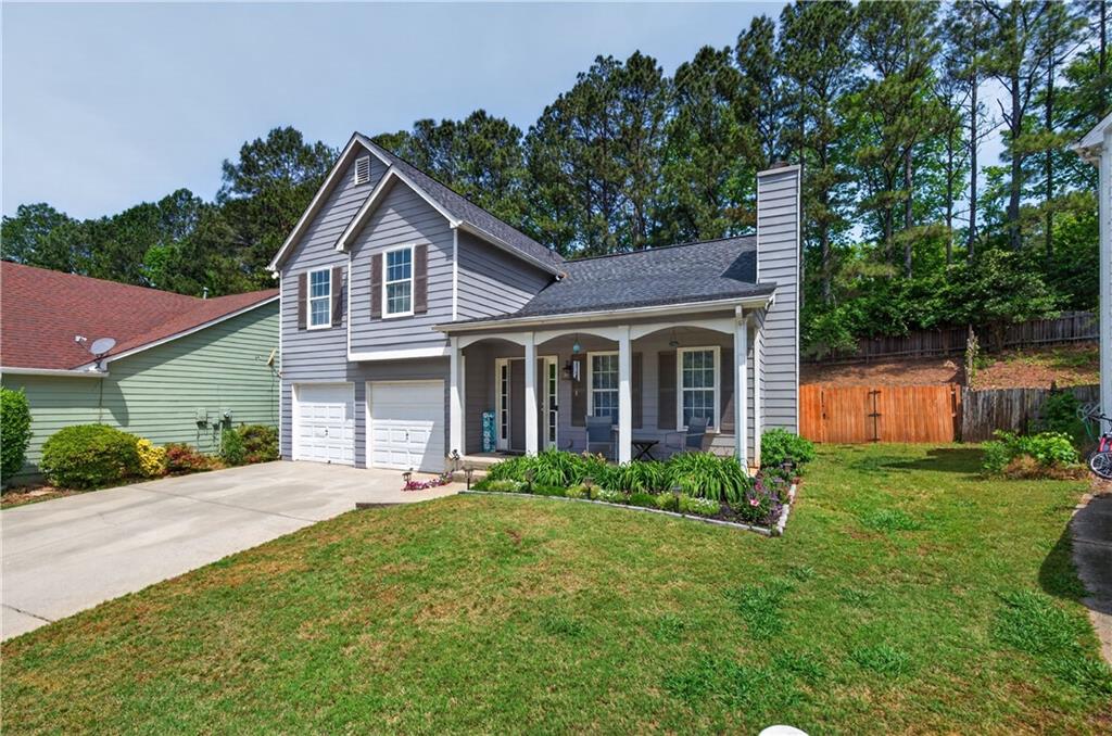 3904 Keystone Ridge Acworth, GA 30101 - Photo 9 of 45 a front view of a house with a yard and potted plants