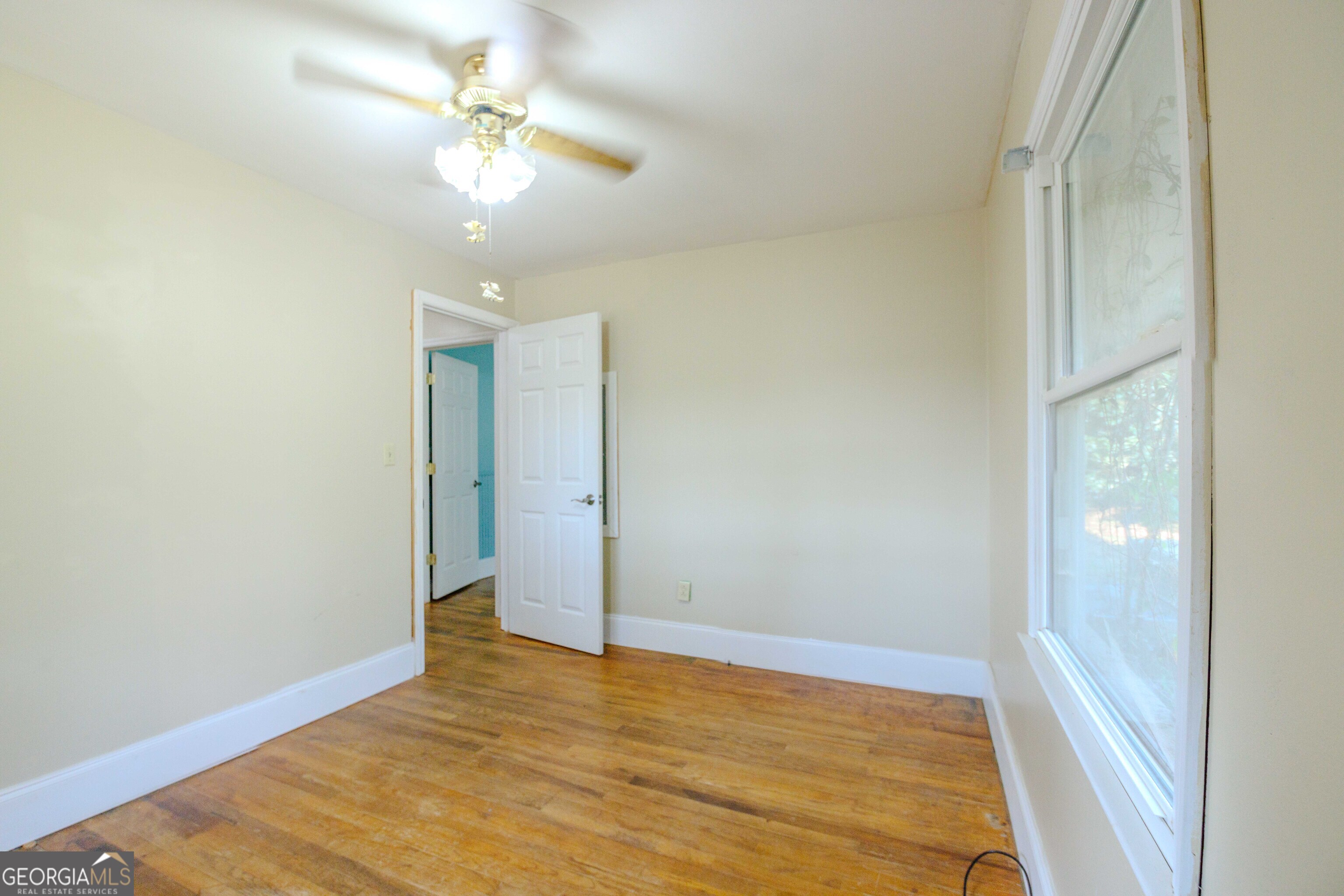 239 Hendry Lane Washington, GA 30673 - Photo 14 of 31 wooden floor in an empty room