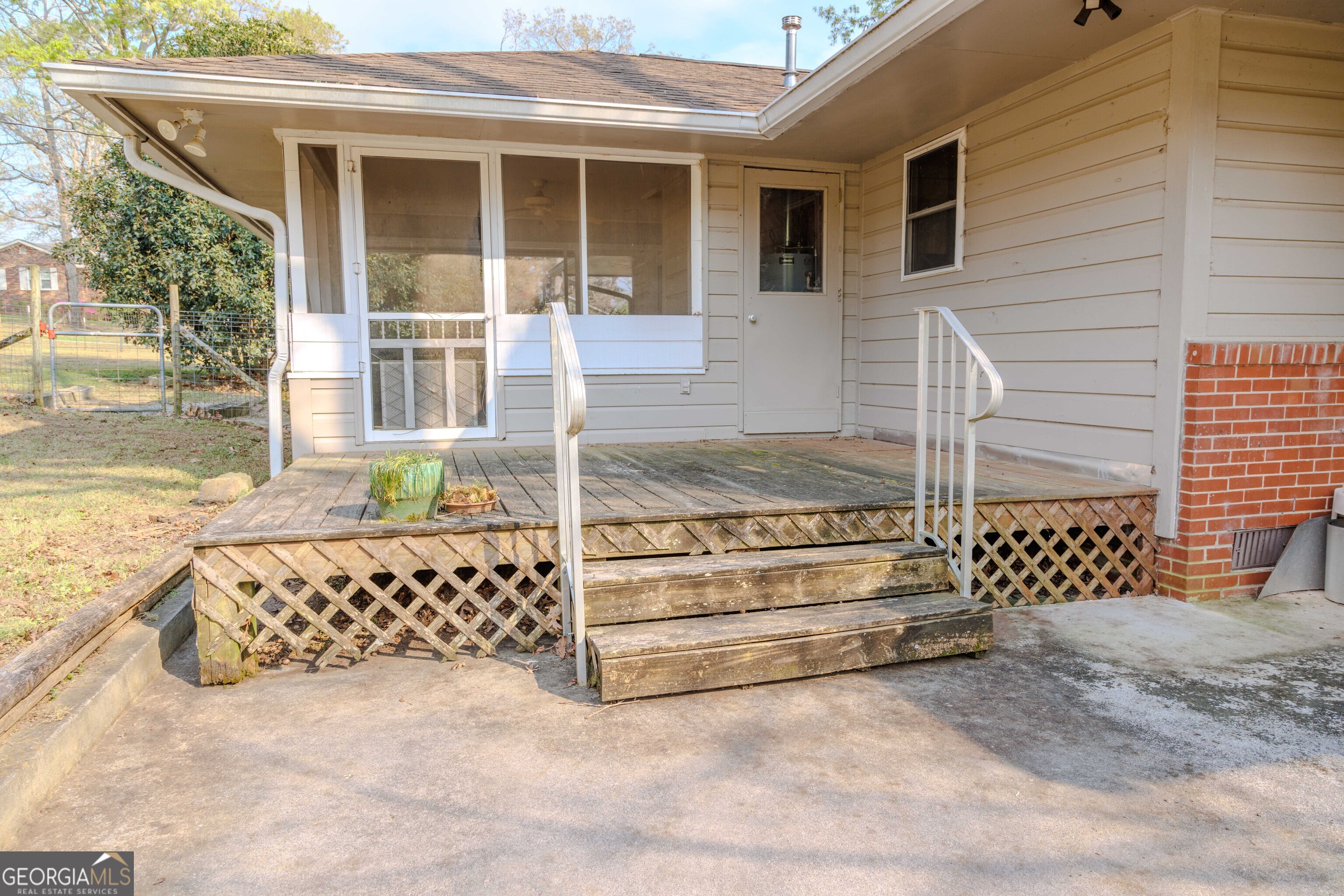 239 Hendry Lane Washington, GA 30673 - Photo 23 of 31 a view of a house with a large window and wooden fence