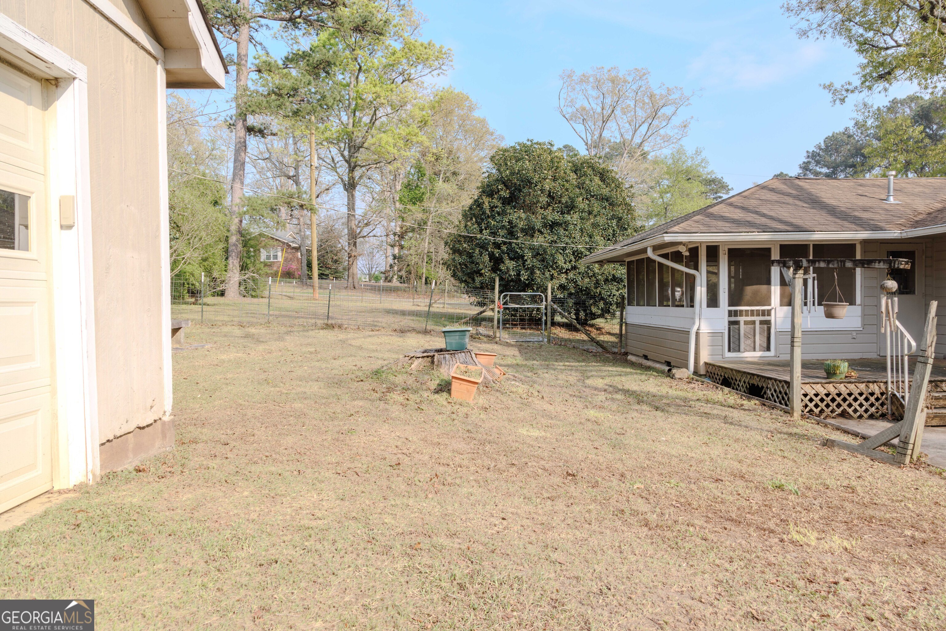 239 Hendry Lane Washington, GA 30673 - Photo 27 of 31 a backyard of a house with barbeque oven fire pit table and chairs
