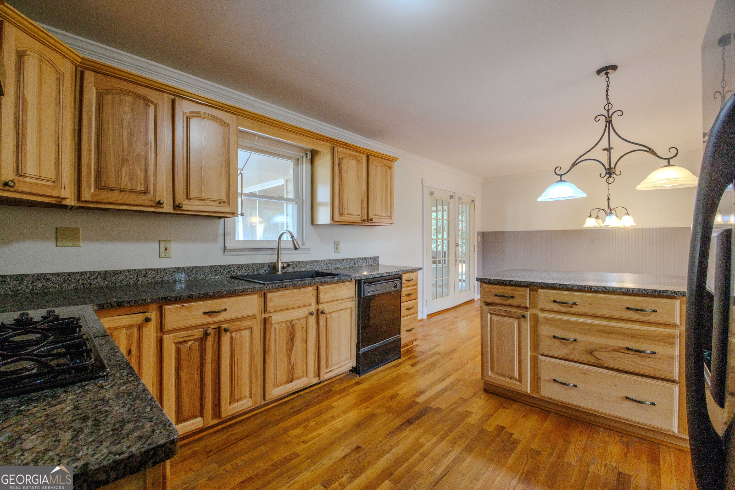 239 Hendry Lane Washington, GA 30673 - Photo 8 of 31 a kitchen with granite countertop wooden cabinets and a stove