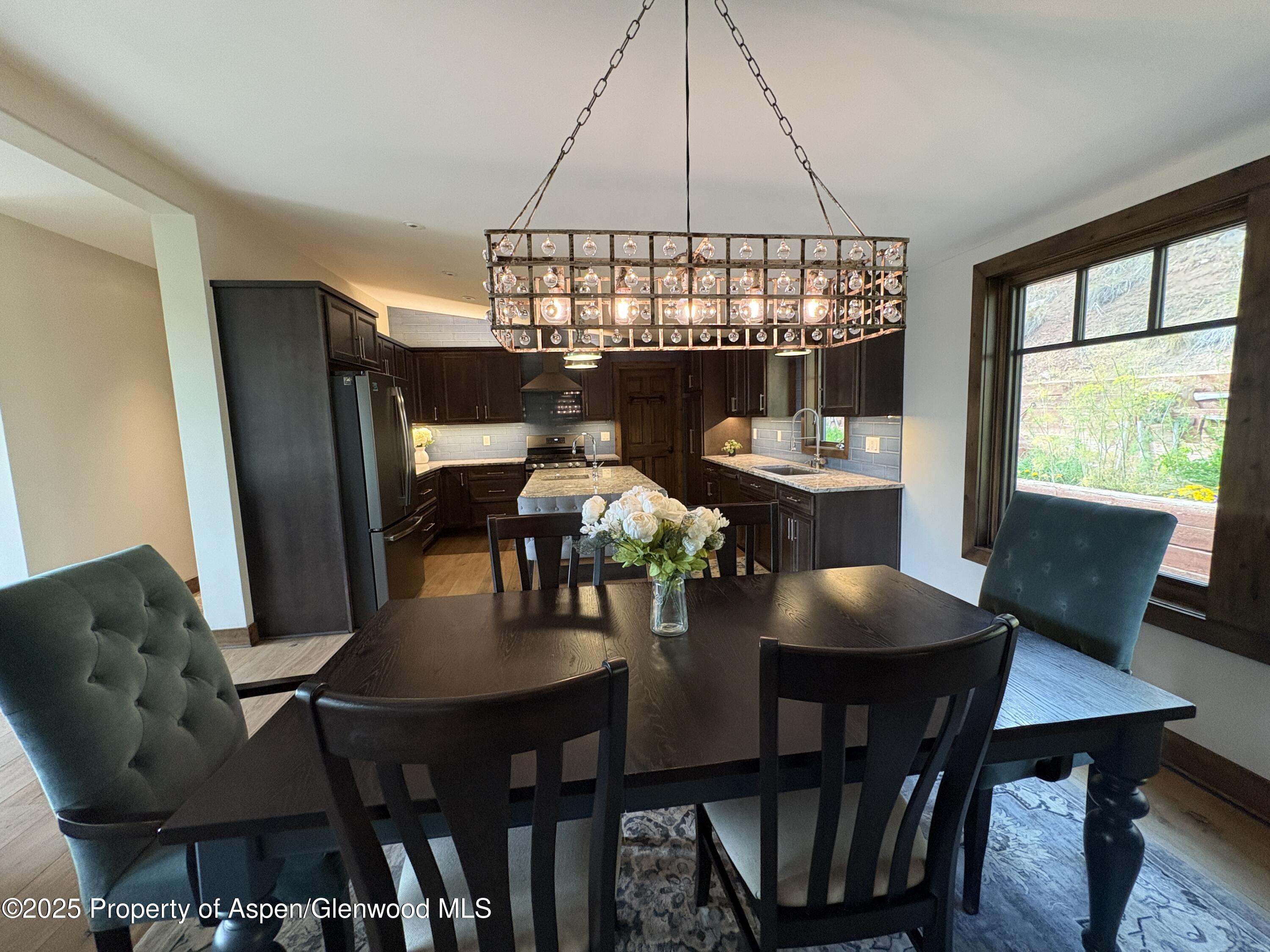 641 Pinon Drive Basalt, CO 81621 - Photo 5 of 17 a view of a dining room with furniture window and wooden floor