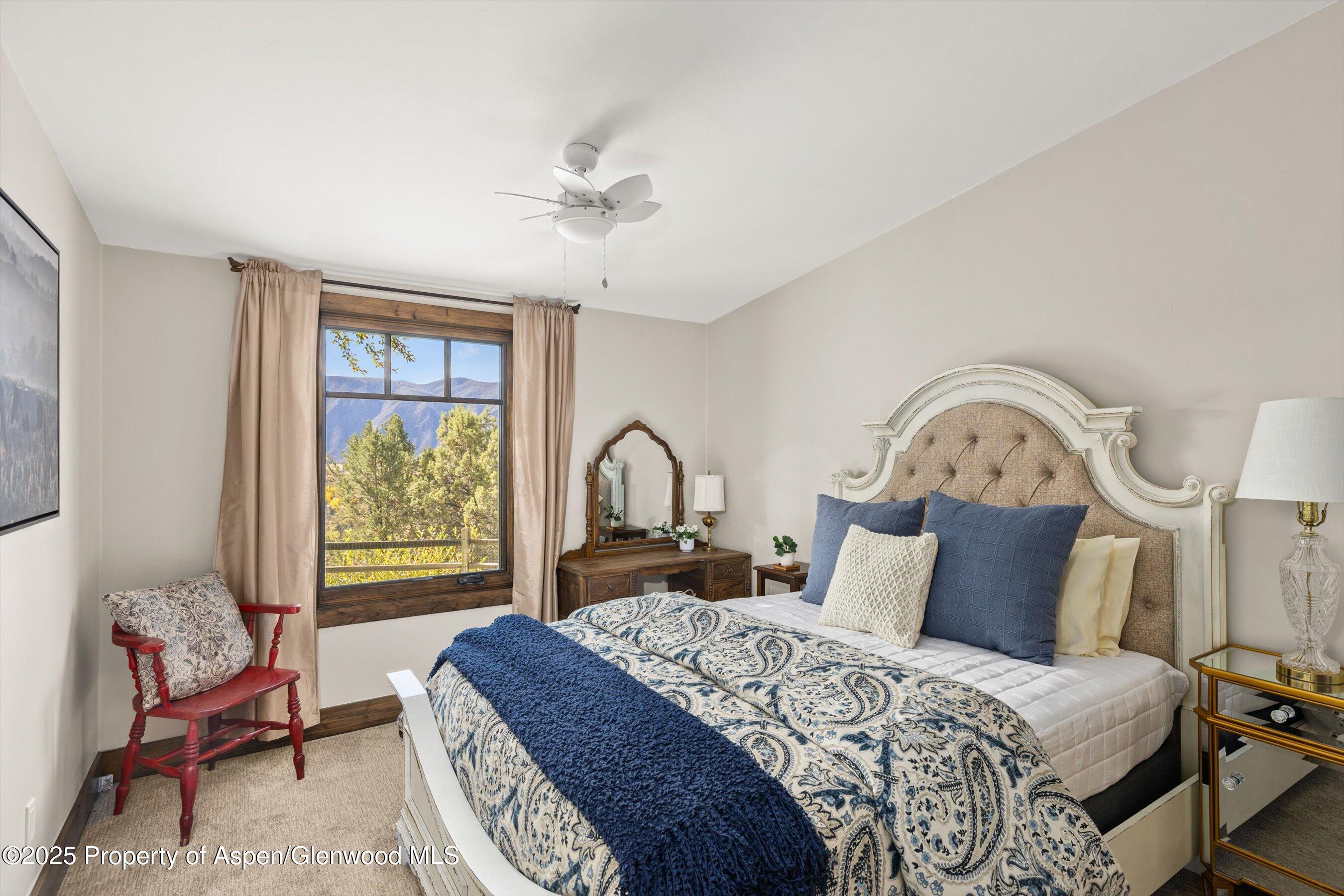 641 Pinon Drive Basalt, CO 81621 - Photo 9 of 17 a bedroom with a bed and a window