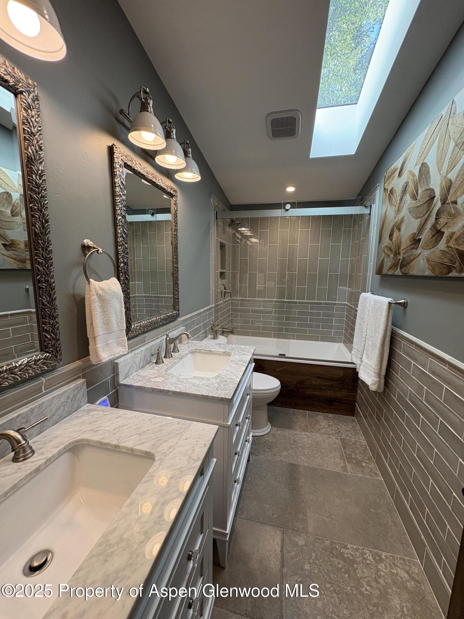 641 Pinon Drive Basalt, CO 81621 - Photo 10 of 17 a bathroom with a tub sink and mirror