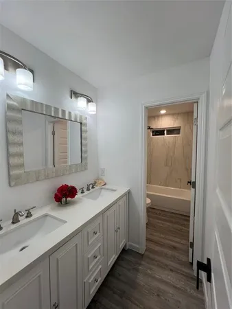 a bathroom with a toilet and a bathtub