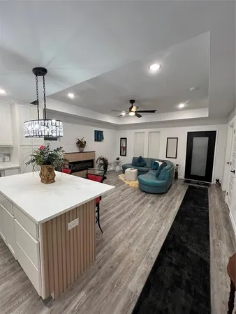a view of kitchen with sink and dining table