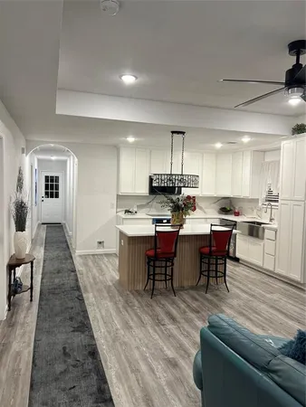 a kitchen with a sink and refrigerator