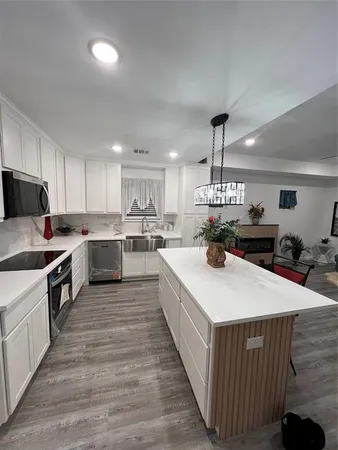 a view of a livingroom with furniture and a window