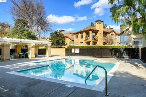 a front view of a house with swimming pool