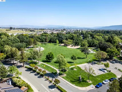 an aerial view of a golf course with houses