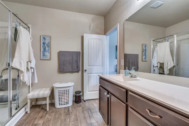 a bath room with a sink and a mirror