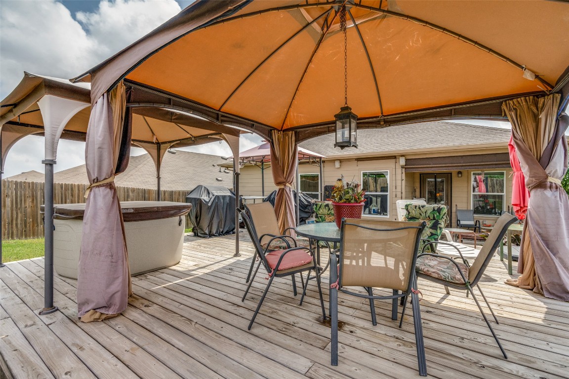 6316 Diamondleaf Bend Austin, TX 78724 - Photo 22 of 25 Wooden deck featuring a gazebo, a grill, and outdoor dining space