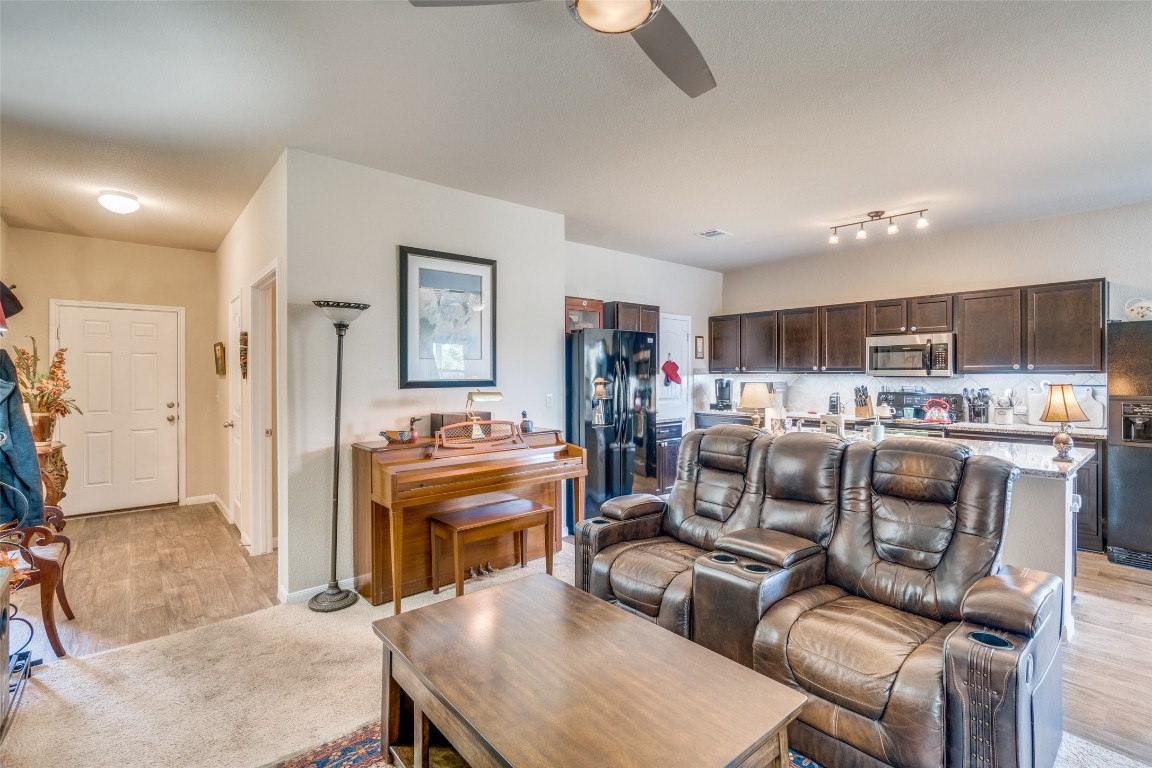 6316 Diamondleaf Bend Austin, TX 78724 - Photo 5 of 25 Living area with light wood-style flooring and ceiling fan
