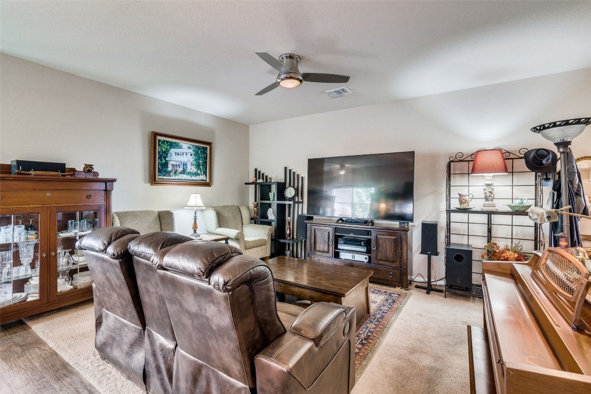 6316 Diamondleaf Bend Austin, TX 78724 - Photo 8 of 25 Living room with ceiling fan