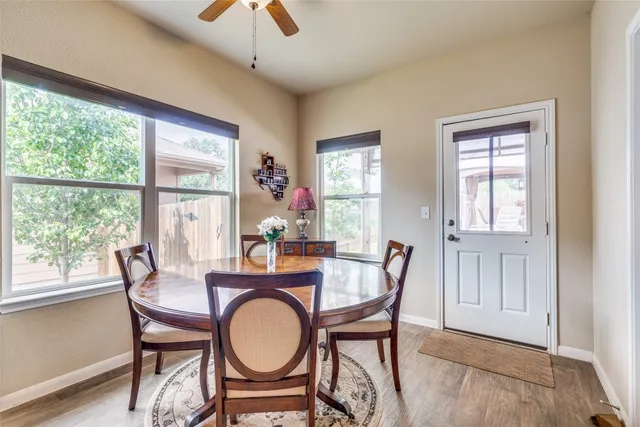 a dining room with furniture and window