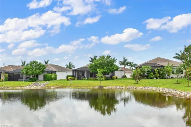 a view of a lake with a house in the background