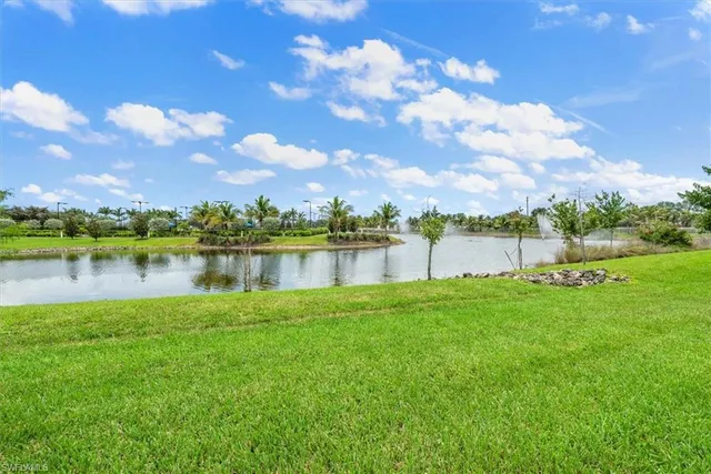 a view of a lake with houses in the back