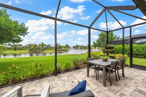 a view of a porch with furniture and yard