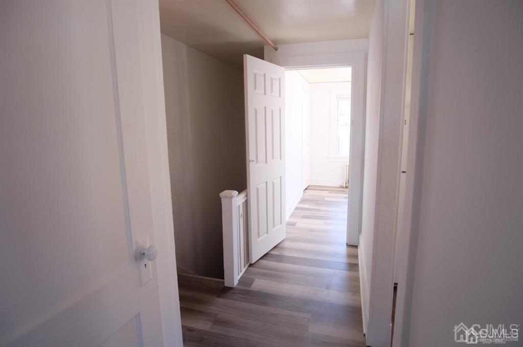 417 Chestnut Street, Unit B Middlesex, NJ 08846 - Photo 6 of 12 a view of a hallway with wooden floor