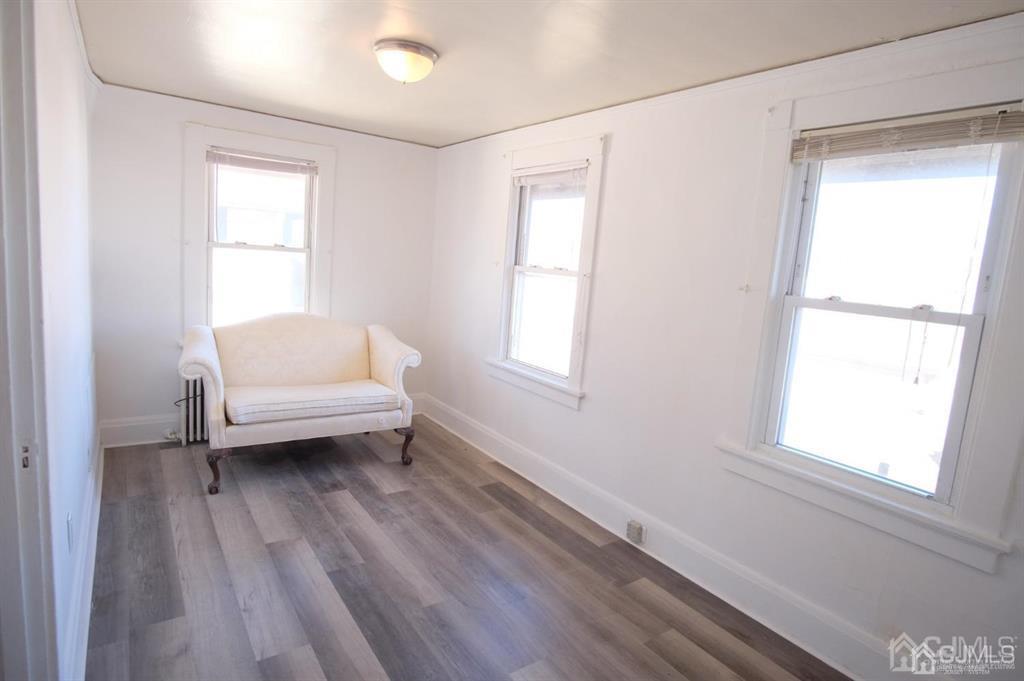 417 Chestnut Street, Unit B Middlesex, NJ 08846 - Photo 7 of 12 a bathroom with a sink a toilet and a window