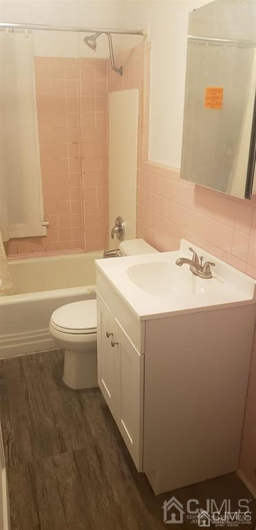417 Chestnut Street, Unit B Middlesex, NJ 08846 - Photo 10 of 12 a bathroom with a sink a toilet and shower