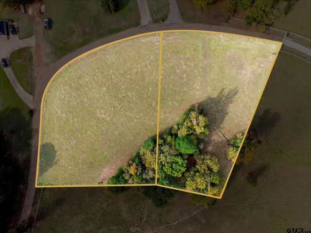 an aerial view of a house having yard