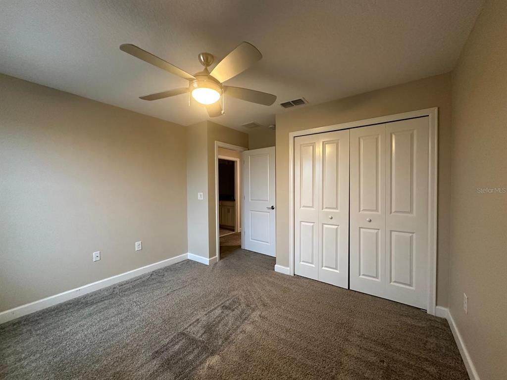 17053 Volume Alley Winter Garden, FL 34787 - Photo 6 of 15 a view of an empty room and chandelier fan