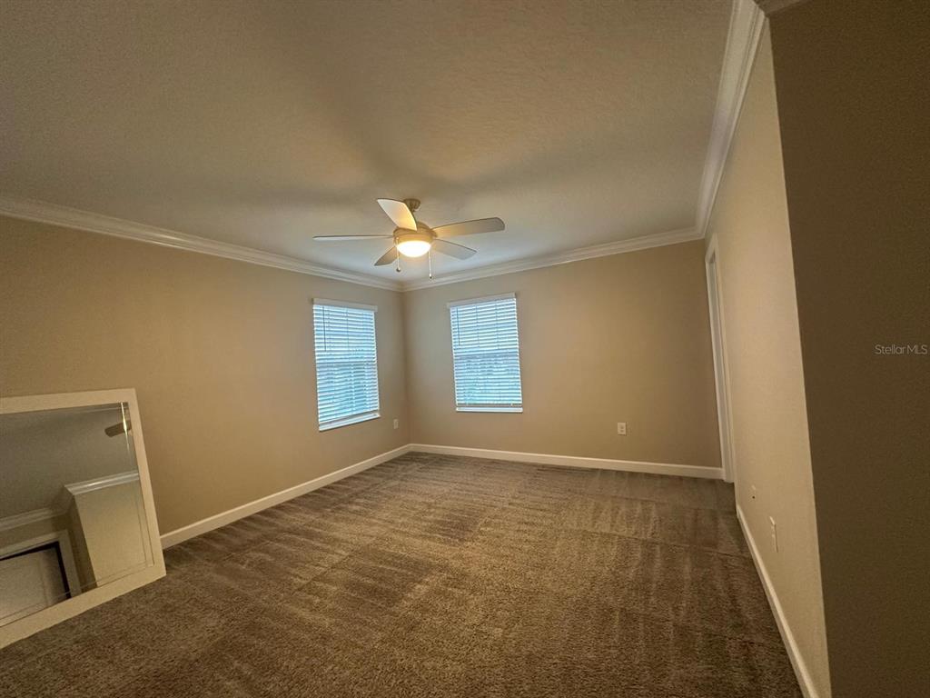 17053 Volume Alley Winter Garden, FL 34787 - Photo 7 of 15 a view of an empty room with a window