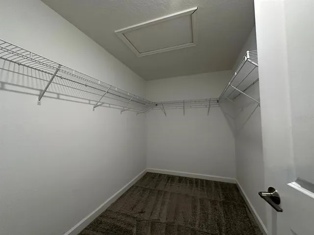 a view of a room with racks on the wall