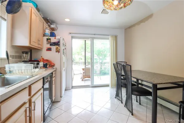 a view of a chair and table in the balcony