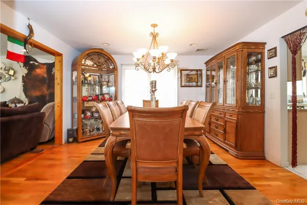 a bedroom with a bed and glass wall