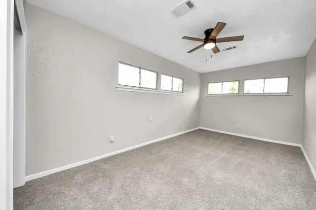 a view of empty room with windows