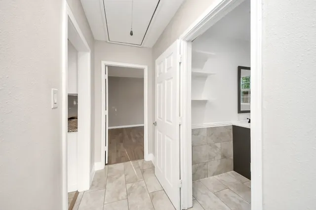 a view of a bathroom with a shower and a sink