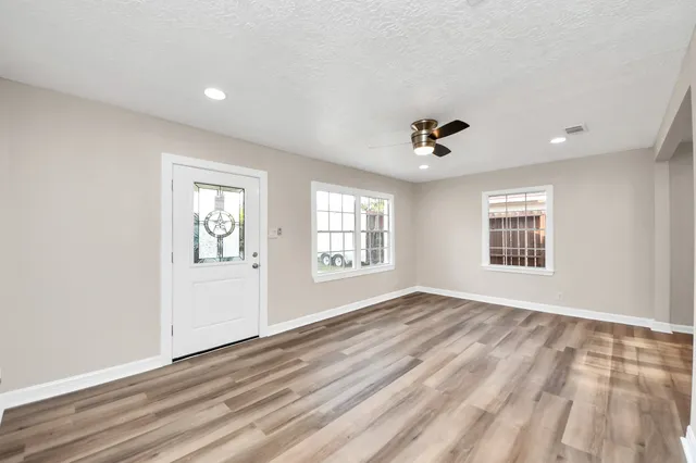 a view of an empty room with a window