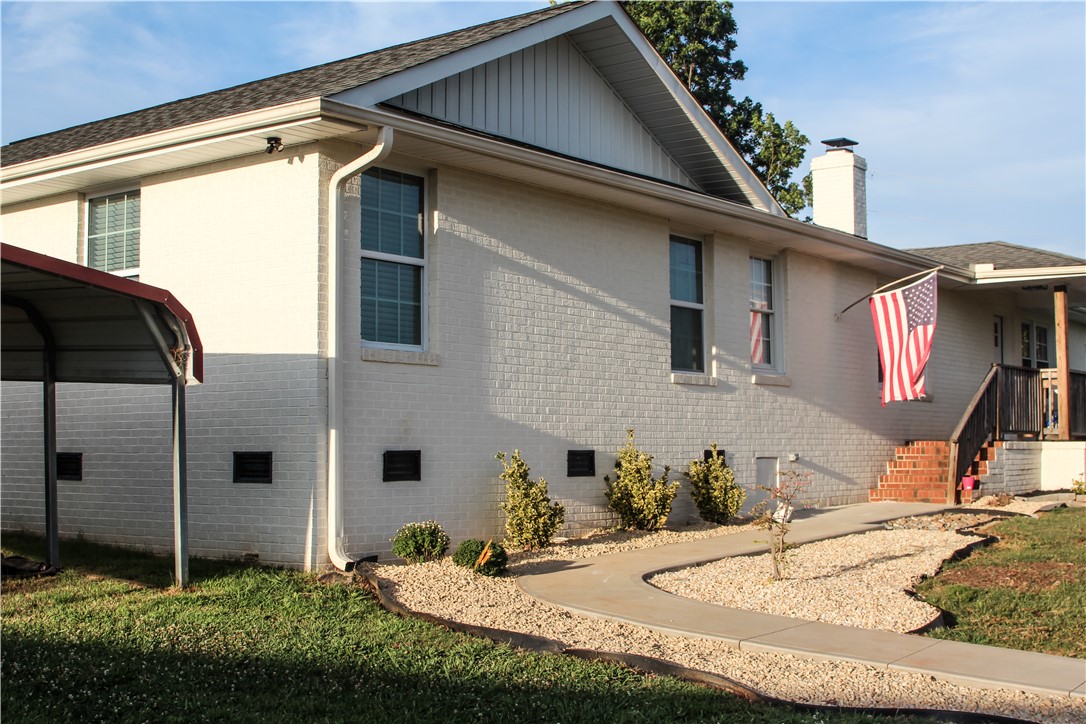 757 Belle Shoals Road Pickens, SC 29671 - Photo 3 of 31 A well-maintained facade features light brickwork, white trim, and a welcoming walkway.