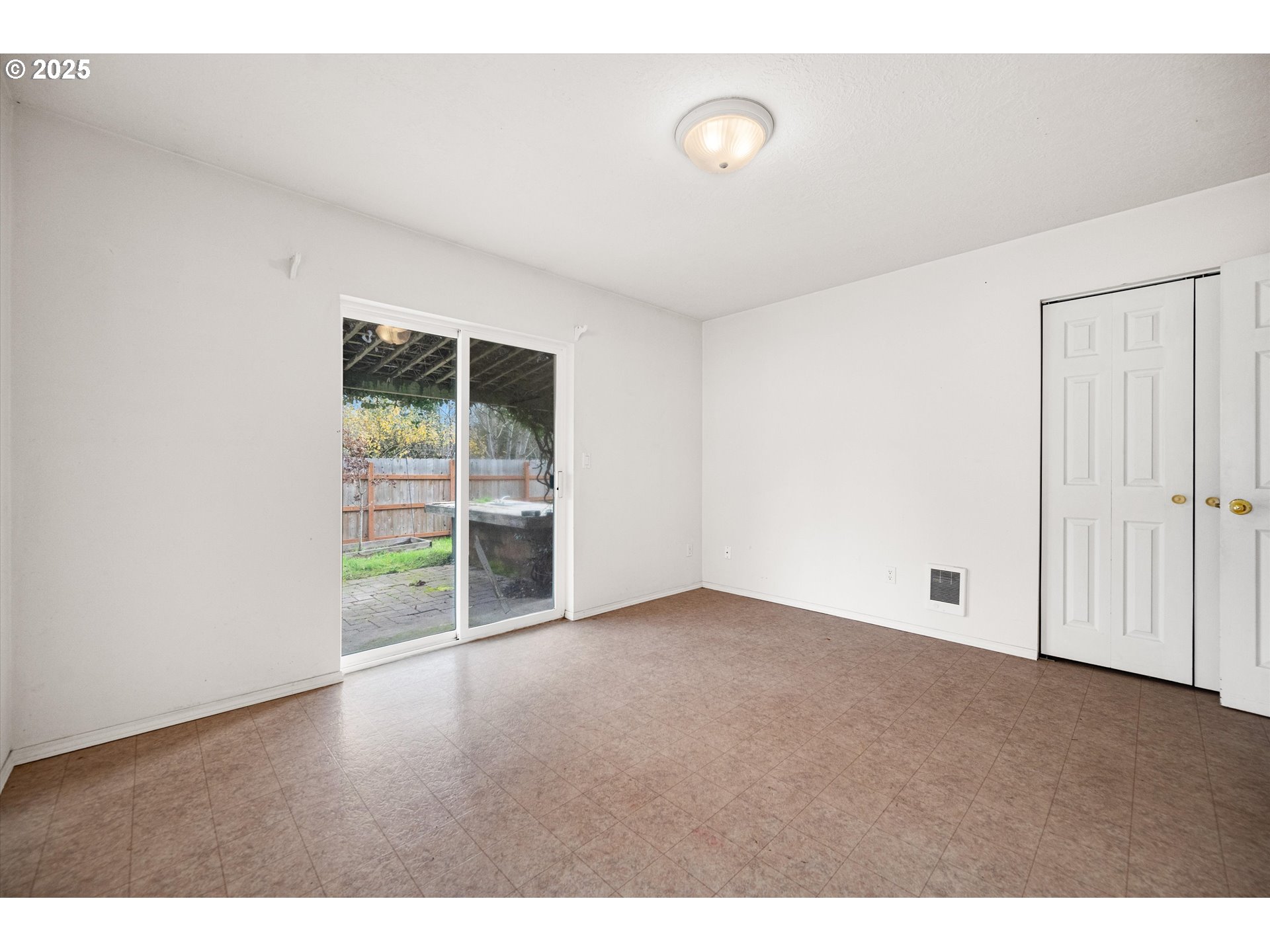 9620 Wells Landing Road Independence, OR 97351 - Photo 13 of 22 a view of an empty room with a window