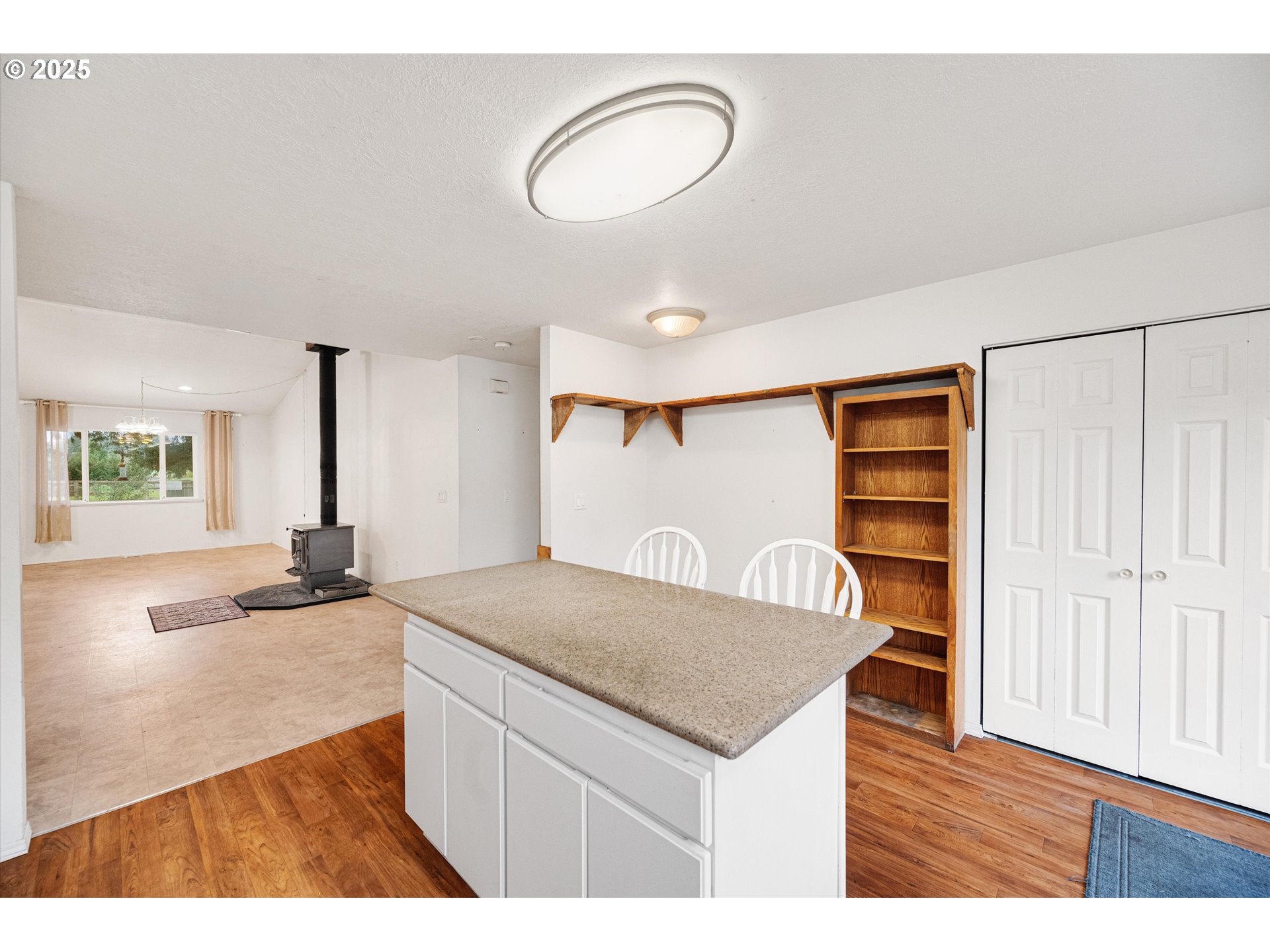 9620 Wells Landing Road Independence, OR 97351 - Photo 9 of 22 a kitchen with a sink cabinets and wooden floor