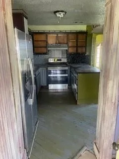 a living room with a fireplace furniture and a flat screen tv