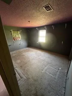 a view of an empty room with windows