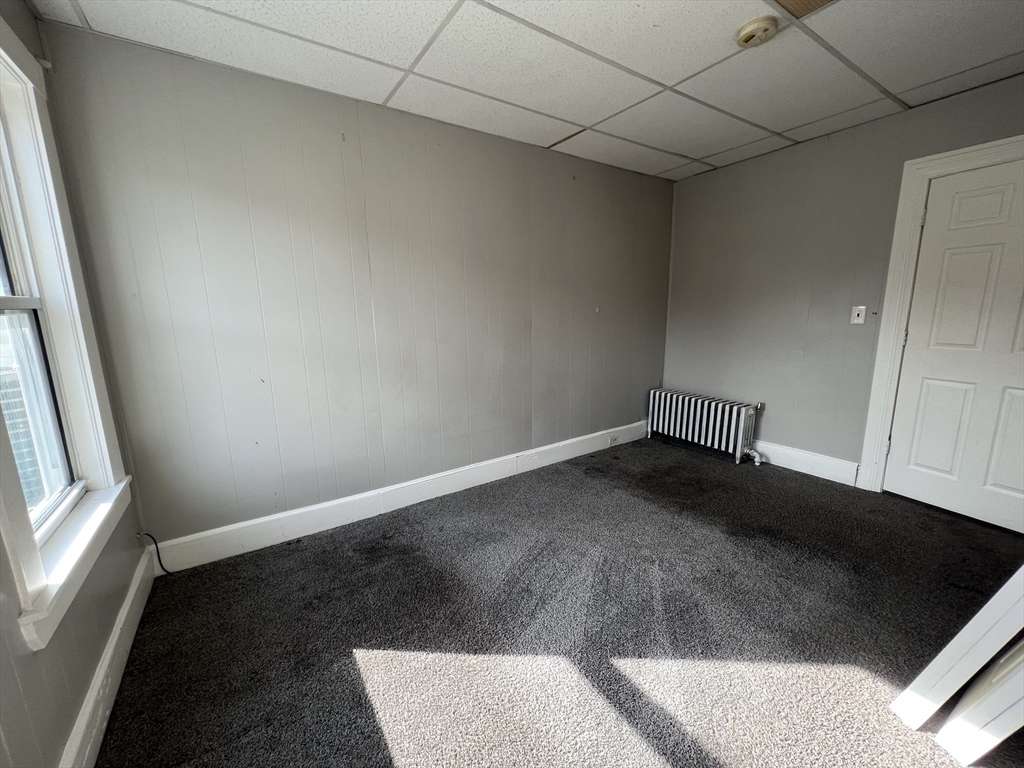 696 Broadway, Unit 1 Chelsea, MA 02150 - Photo 6 of 12 a view of an empty room and window