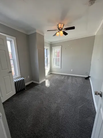a bathroom with a toilet sink and window